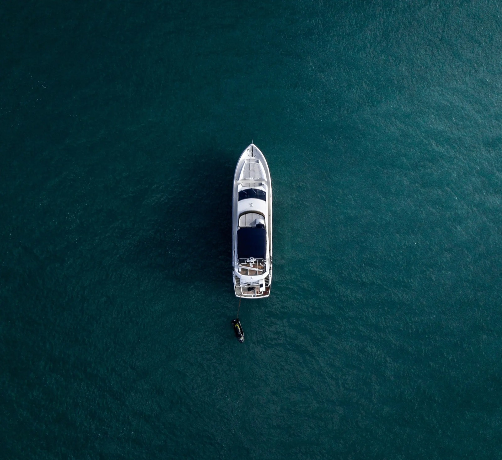 Aerial view of a boat on dark water